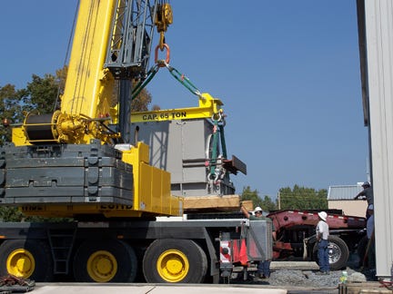 Two Worker Looking the 65 ton Condenser