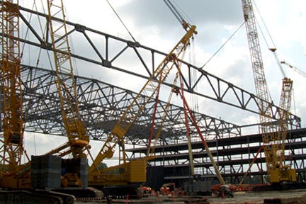 Closer Image of Cranes Holding Steel