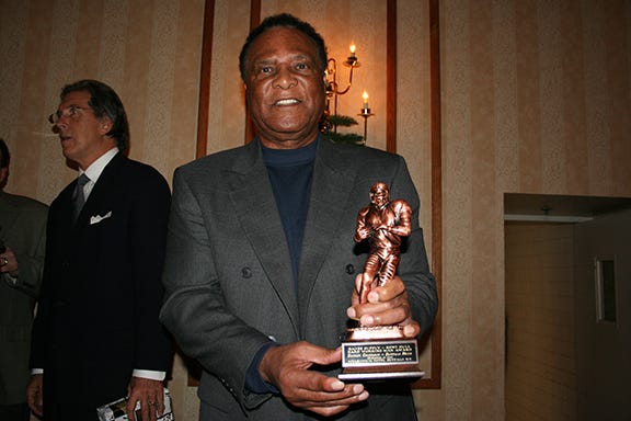 Booker Edgerson Holding the Award