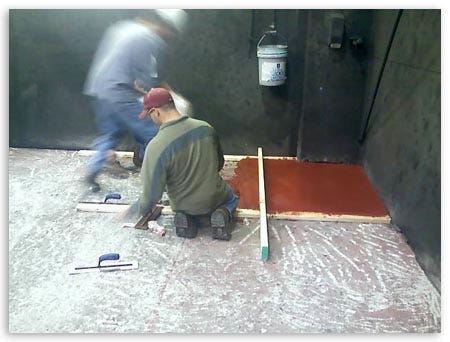 Workers Scrapping Red Paint