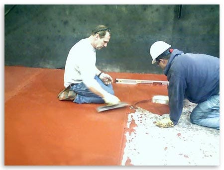 Workers Scrapping Red Paint Back View